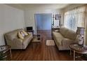 Comfortable living room featuring hardwood floors, neutral walls, and lots of natural light at 2612 E 17Th Ave, Tampa, FL 33605