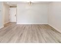 Bright living room with light gray flooring, a ceiling fan and fresh white walls at 3568 Wilkinson Woods Dr # 23, Sarasota, FL 34231
