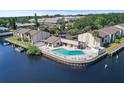 A waterfront community pool with lounge chairs offers a relaxing and scenic amenity at 358 Moorings Cove Dr # 4B, Tarpon Springs, FL 34689