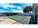 Outdoor shuffleboard courts with seating area, perfect for community recreation at 4359 Tahitian Gardens Cir # A, Holiday, FL 34691