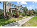 Beautiful two-story home with well-manicured lawn and sidewalk at 5955 Caldera Ridge Dr, Lithia, FL 33547
