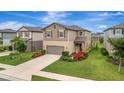 Well maintained two-story home, with inviting curb appeal, landscaping, and a driveway at 6555 Kenava Loop, Palmetto, FL 34221