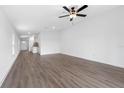 Spacious living room with modern flooring and neutral walls, perfect for relaxation at 16313 Scaup Duck Ave, Brooksville, FL 34614