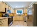 Well-equipped kitchen with stainless steel appliances, granite countertops, and ample cabinet space at 17544 Fairmeadow Dr, Tampa, FL 33647
