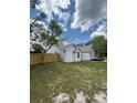 Well-maintained home with a fenced yard, providing privacy and security at 23220 Shining Star Dr, Land O Lakes, FL 34639