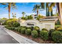 Elegant community entrance sign with lush landscaping and mature palm trees, creating a welcoming atmosphere at 7903 Seminole Blvd # 2203, Seminole, FL 33772