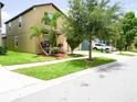 Residential home boasts an attached garage and a manicured front yard at 9650 Sage Creek Dr, Ruskin, FL 33573