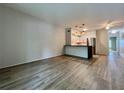 Inviting living room featuring wood floors, ample space, and an open view of the modern kitchen at 2400 Franciscan Dr # 28, Clearwater, FL 33763