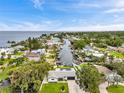 Waterfront community aerial view highlighting a canal system with boat docks on a sunny day at 3436 Manatee Se Dr, St Petersburg, FL 33705