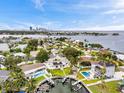 Beautiful aerial view of waterfront homes, boat docks and city skyline in the distance at 3436 Manatee Se Dr, St Petersburg, FL 33705