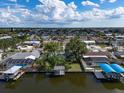 Waterfront neighborhood aerial view, showcasing numerous homes, canals, and boat docks at 911 Sago Palm Way Way, Apollo Beach, FL 33572