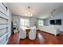 Stylish dining room with modern chandelier, seating, and an open floor plan with lots of light at 7001 Interbay Blvd # 121, Tampa, FL 33616