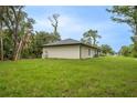 Lush green backyard provides ample space and a tranquil outdoor setting at 18146 Sinatra Ave, Port Charlotte, FL 33954