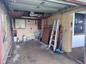A cluttered one car garage with storage and work space capabilities at 3234 37Th N St, St Petersburg, FL 33713