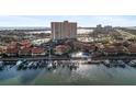An aerial view of the real estate property on the water with a community pool and boat docks at 4900 Brittany S Dr # 1011, St Petersburg, FL 33715