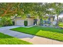 Beautiful single-story house boasts a lush lawn and inviting facade at 12218 Avondale Oak Pl, Riverview, FL 33578