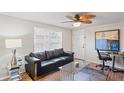 Bright living room featuring a comfortable sofa and modern decor at 1980 Tahitian Pl # 10, Dunedin, FL 34698