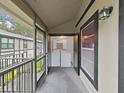 Screened in porch with full-sized washer and dryer and exterior view at 3964 Dream Oak Pl # 203, Tampa, FL 33613