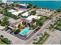 Aerial view of waterfront property with pool and ample parking at 64 Bay Esplanade # 503, Clearwater, FL 33767