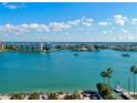 Stunning waterfront view with boats, calm water, and distant buildings at 64 Bay Esplanade # 501, Clearwater, FL 33767