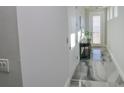 Modern hallway with marble floors and natural light at 7834 Hidden Creek Loop # 104, Lakewood Ranch, FL 34202