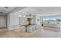 Open concept dining area with modern table and chairs at 44 Bayview S Ct # A, St Petersburg, FL 33711