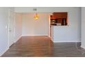 Bright dining area with wood-look floors and kitchen access at 10200 Gandy Blvd # 1229, St Petersburg, FL 33702