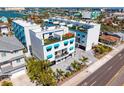 Modern condo building with a coastal aesthetic, roof top terraces, and charming awnings at 15405 Gulf Blvd # B1, Madeira Beach, FL 33708