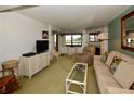 Relaxing living room with comfy seating and a fireplace at 128 1St E St # 203, Tierra Verde, FL 33715