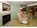 Living room with fireplace and seating area at 128 1St E St # 203, Tierra Verde, FL 33715
