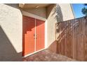 Attractive coral-colored double front doors leading to a brick patio at 4451 Tidal Pond Rd, New Port Richey, FL 34652