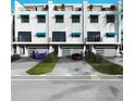 Modern three story townhomes with attached garages and private balconies at 11605 1St E St # A-4, Treasure Island, FL 33706