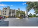 Condo building exterior with parking and landscaping at 1200 Country Club Dr # 6103, Largo, FL 33771