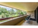 Balcony with golf course view and seating at 36750 Us Highway 19 N # 21305, Palm Harbor, FL 34684