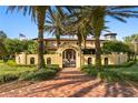 Grand estate entrance with brick walkway and wrought iron gates at 33642 Blanton Rd, Dade City, FL 33523