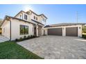 Two-story house with a two-car garage and a paved driveway at 2011 Belleair Rd, Clearwater, FL 33764