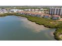 Aerial view of waterfront condos and lush landscaping at 5715 Yeats Manor Dr # 201, Tampa, FL 33616