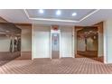 Building lobby with elevators and modern flooring at 6322 Palma Del Mar S Blvd # 505, St Petersburg, FL 33715