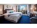 Ocean view bedroom with a king bed and sitting area at 5500 Gulf Blvd # 5227, St Pete Beach, FL 33706