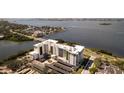 Stunning aerial view of waterfront condos showcasing sleek design and picturesque bay views at 1020 Sunset Point Rd # 603, Clearwater, FL 33755