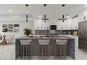 Modern kitchen with large island and pendant lighting at 211 Dolphin Pt # 201, Clearwater, FL 33767