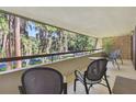 Balcony with wooded view and outdoor seating at 36750 Us Highway 19 N # 04239, Palm Harbor, FL 34684