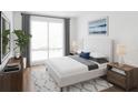 Spacious bedroom with a king-size bed and ample natural light at 600 3Rd S Ave # 209, St Petersburg, FL 33701
