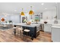 Renovated kitchen with island, stainless steel appliances, and white cabinetry at 2441 69Th S Ave, St Petersburg, FL 33712