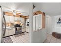 Kitchen features stainless steel appliances and tiled flooring at 5537 Sea Forest Dr # 302, New Port Richey, FL 34652