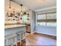 Modern kitchen with light green cabinets and granite countertops at 3629 28Th S Ave, St Petersburg, FL 33711