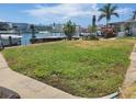 Large grassy waterfront lot with canal views at 15318 Harbor Dr, Madeira Beach, FL 33708