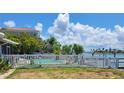 Residential pool with white vinyl fence at 15318 Harbor Dr, Madeira Beach, FL 33708