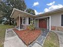 Updated house exterior with a brick facade and a welcoming front entrance at 4004 W Coachman Ave, Tampa, FL 33611