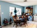 Dining area with table, chairs, and hutch at 1942 Alton Dr, Clearwater, FL 33763